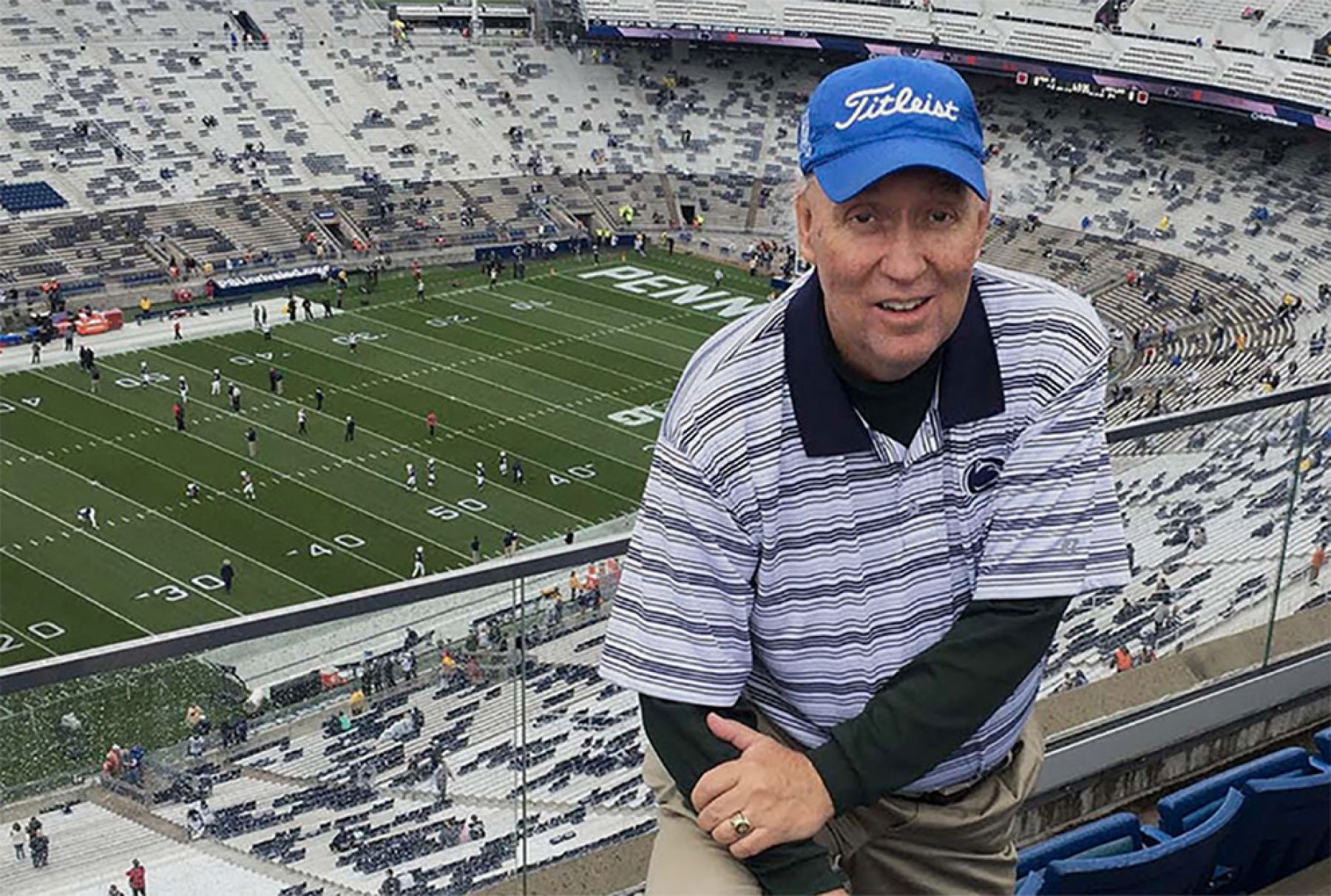 The late Rick Starr stands along in the bleachers at Beaver Stadium
