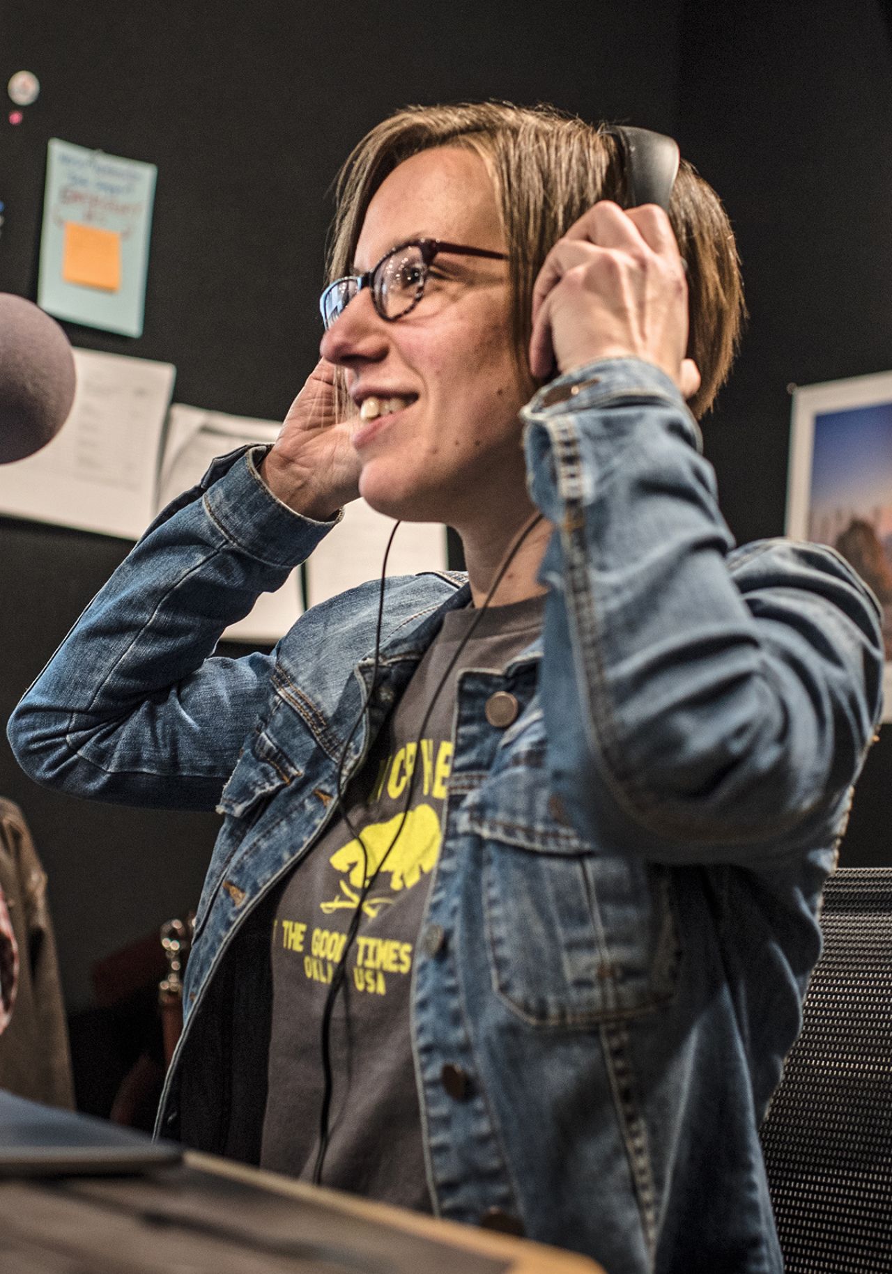 Photo of podcaster Jenna Spinelli with a radio headset