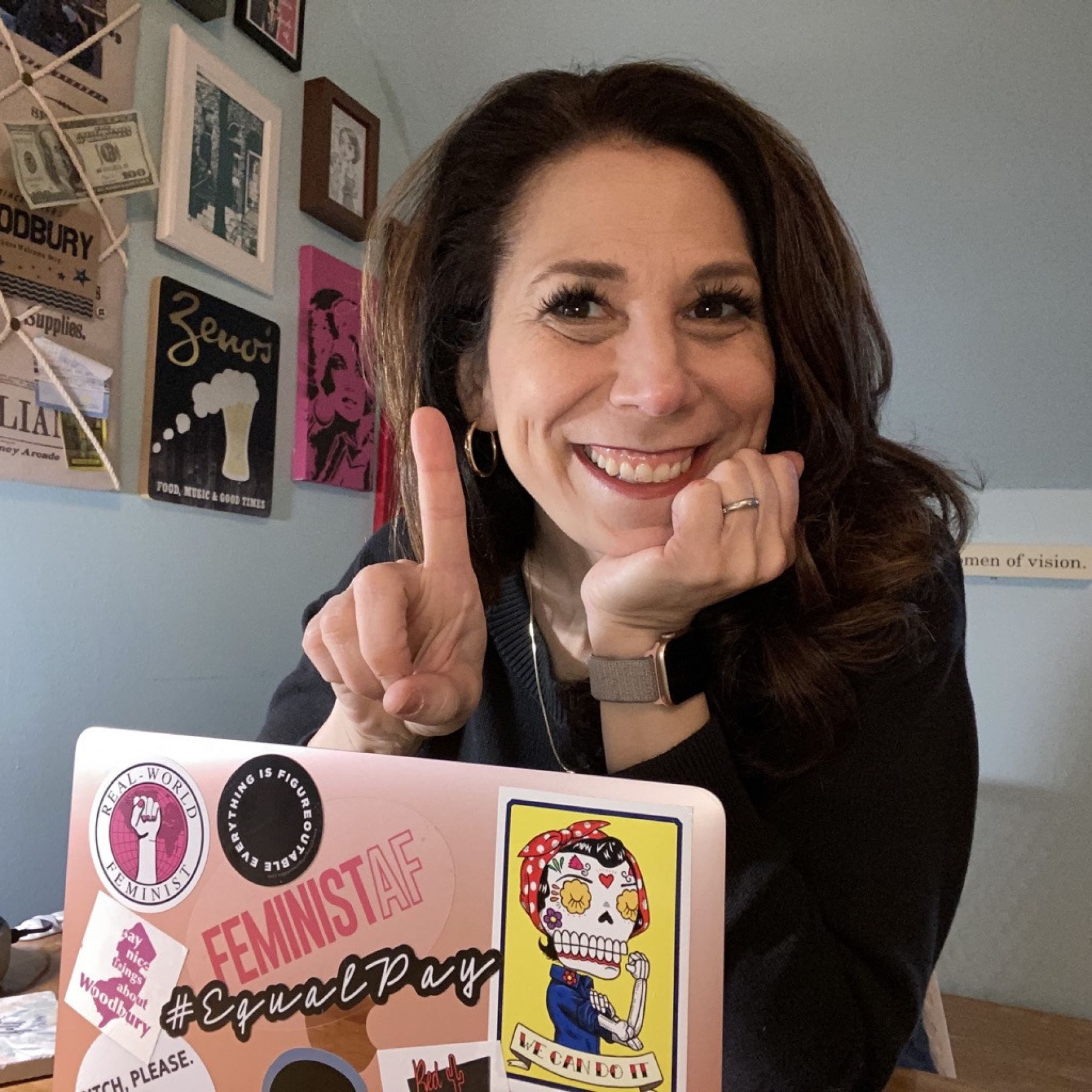 Podcaster and alumna Michelle Kinsman in her office with her laptop