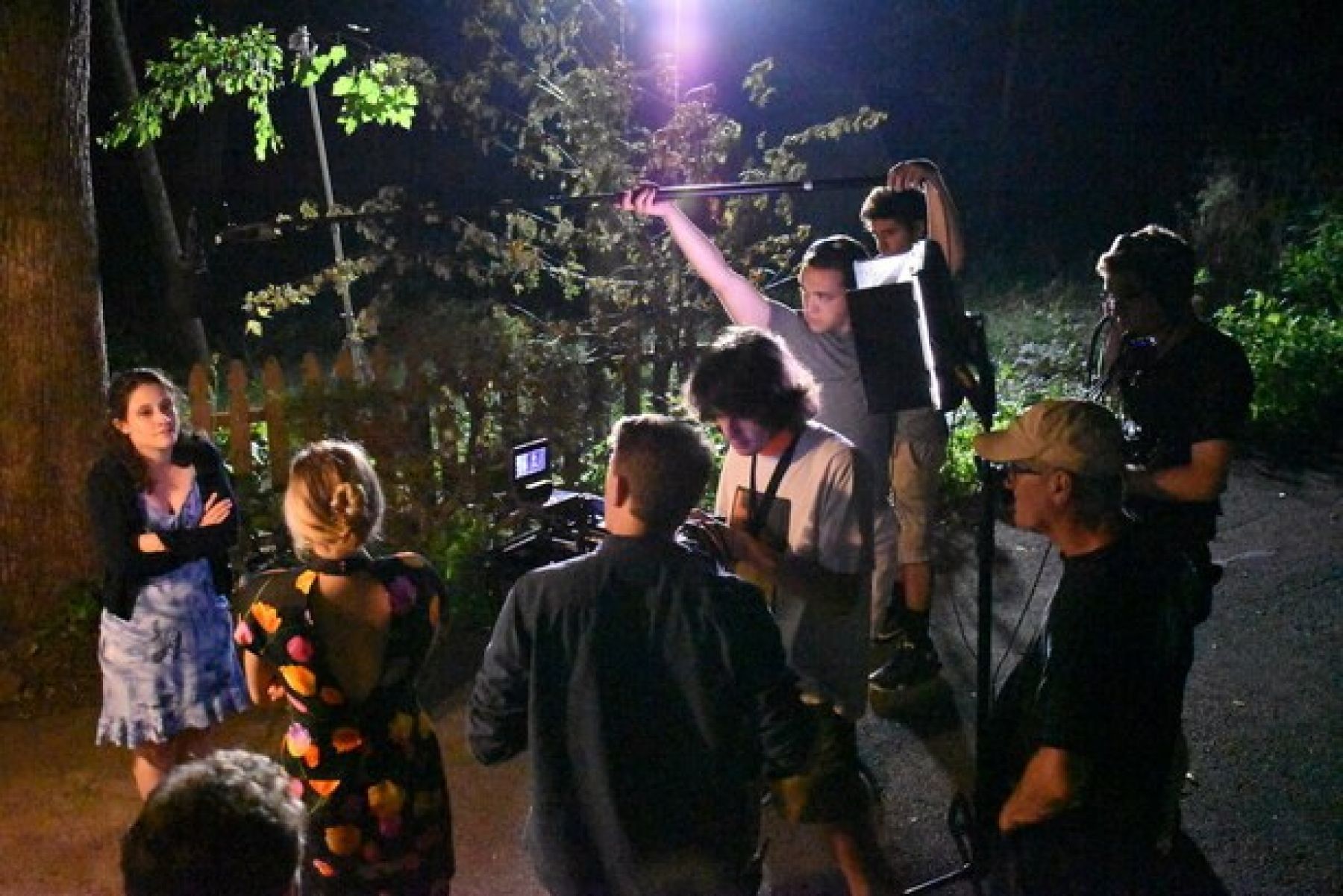 Maura Shea and Rod Bingaman with a camera crew and sound people shooting a film on location at night with lights