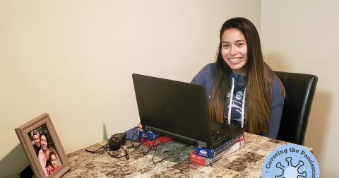 Alumna Lesly Salazar works from her kitchen table.