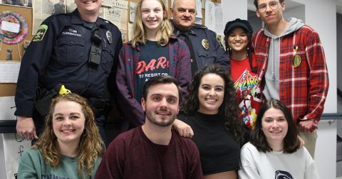 Student filmmakers, group photo, with members of Tyrone Police Department.